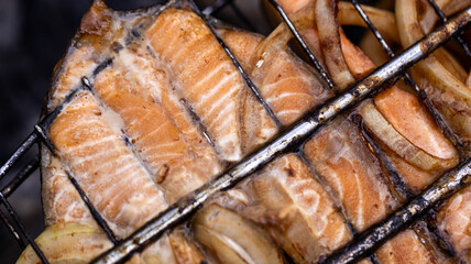 Savor the incredibly delicious grilled salmon steaks accompanied by perfectly cooked onions, a true...