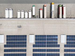 Logistic center with solar panels on roof. Aerial view