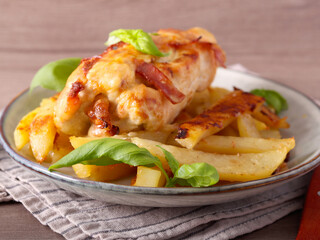 stuffed chicken fillets over potatoes