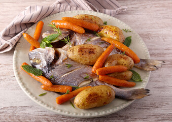 sea bream fish with carrot and potato