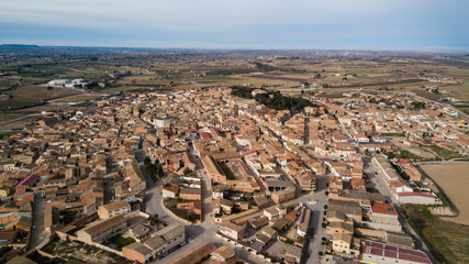 Aerial drone view over the town of Arbeca, Les Garrigues, Lleida, Catalonia. Typical Olive Grove Land