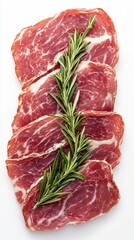 Obraz premium Freshly sliced, marbled meat is beautifully presented on a white background, garnished with fragrant rosemary, showcasing culinary artistry in food photography for chefs and restaurants.