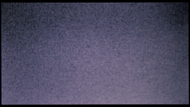 close-up of the screen texture of an old VHS video tape file, with a blue color dot background and a grainy film effect. Photo overlay via blend mode or half dot print layer.