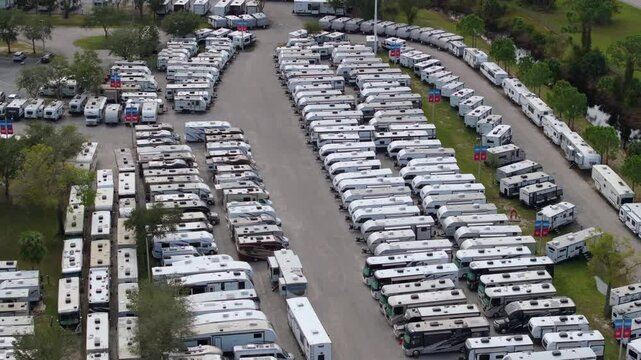 RV dealer parking lot with camping travel trailers for sale in Florida.