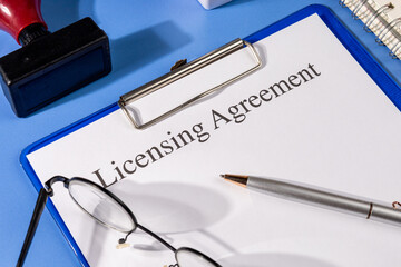 Licensing Agreement Form on Clipboard – Intellectual Property Law Office Scene
