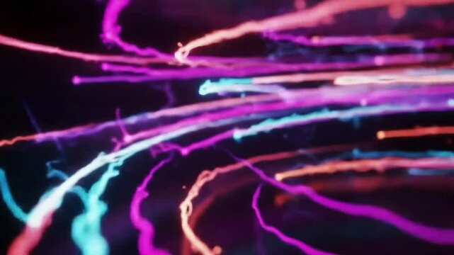 Neon light trails flowing through darkness.