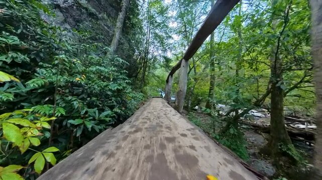 Low Angle of Flying Over Narrow Bridge on the way to Abrams Falls