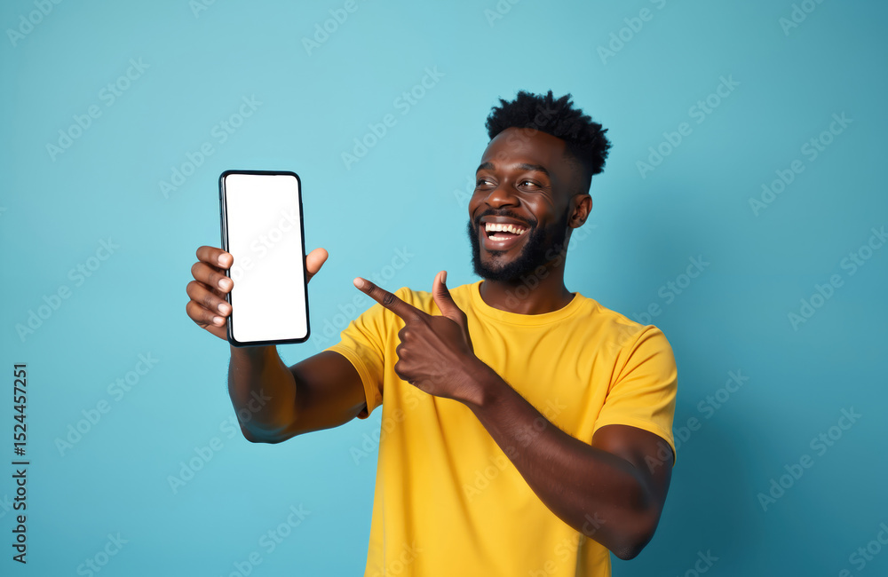 Poster joyful black man points at smartphone with empty screen, mockup for app or website. happy african am