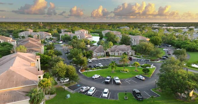 Suburban Florida condos with car parking area, representing family housing and residential planning in the USA.