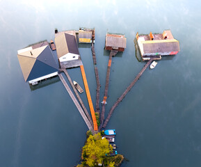 Explore the calm floating village in Hungary during early morning light over the peaceful water