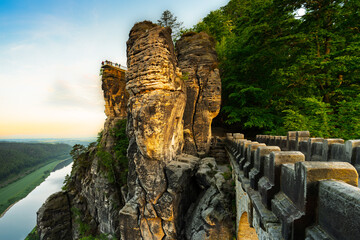 Stunning view from the Bastei Bridge overlooking the Elbe River at sunset in Saxon Switzerland