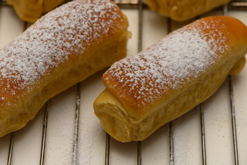 Golden Parker House Rolls Cooling After Baking on Rack
