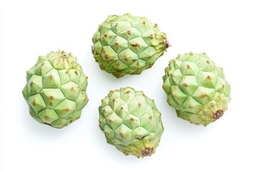 Obraz premium Four cherimoya fruits isolated on white background, a tropical and exotic delight