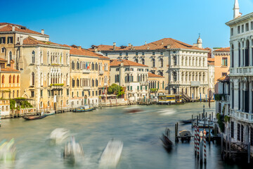Busy Grand Canal with boats and historic palaces in Venice, Italy