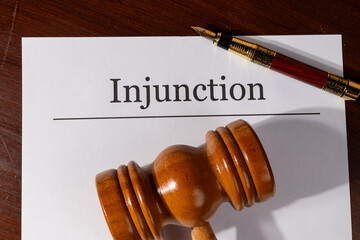 Injunction Order Document Set with Gavel and Pen – Legal Enforcement Concept