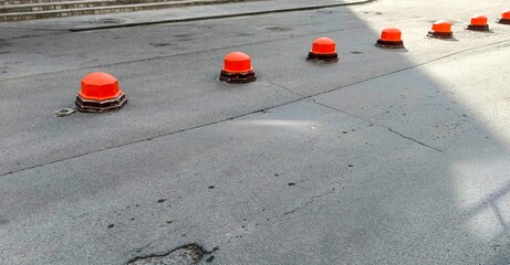 Traffic cones on the road in the city, closeup of photo