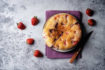Cake with strawberries in a plate