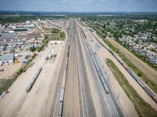 Train track with a lot of trains on it