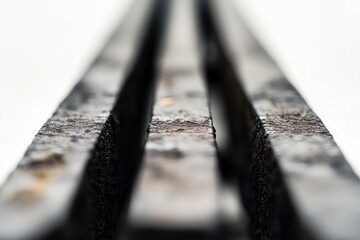 Close-up of three parallel, dark gray/black slabs
