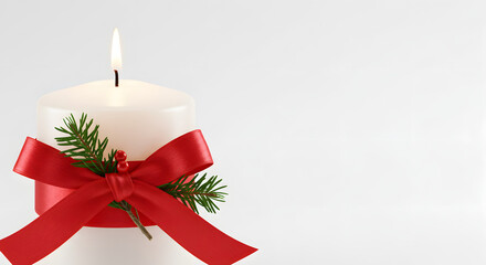 Candle with a Red Ribbon and Christmas Decorations