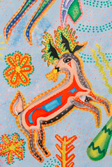 Colorful deer artwork with vibrant patterns and designs in a playful style from a local artist's exhibition