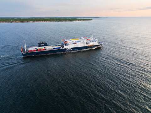 PALDISKI, ESTONIA &ndash; JUNE 7, 2025: A DFDS Seaways roll-on/roll-off passenger and cargo ferry sails in the Baltic Sea near the coastline after departing from port.