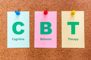 Conceptual 3 letters keyword CBT (Cognitive Behavioral Therapy), on multicolored cards attached to a cork board.