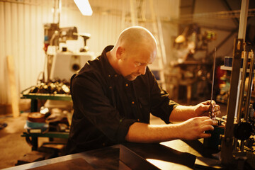 Male factory worker working in a factory workshop