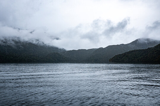 Misty foggy fiords new zealand milford sound fiordland national park beautiful sea rain nature landscape