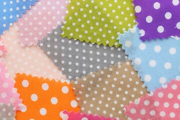 Samples of different fabrics as background, top view