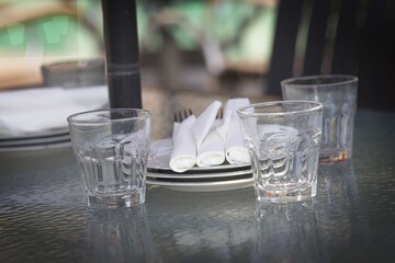 Elegant Table Setting with Empty Glasses and Napkins
