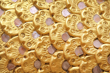Naga scale seamless patterns on gold yellow background