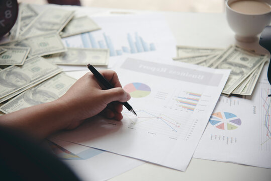 Hand holding money dollar bank note in wallet give financial payment. Man hands showing spread 100 dollar exchange cash payout. Saving Businessman counting money banknote bribe corruption concept.