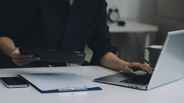 Two asian team working development of programming and encryption technology website design programmers on desk in office