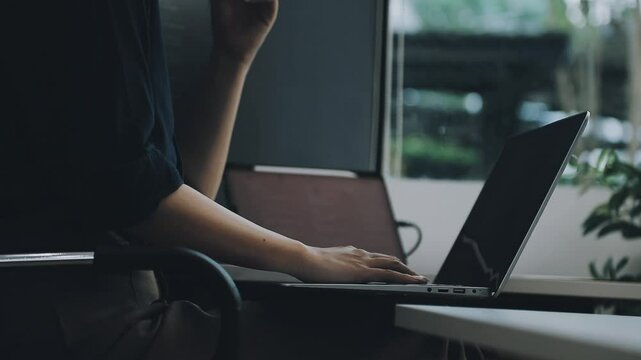 Two asian team working development of programming and encryption technology website design programmers on desk in office
