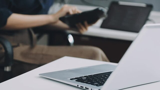 Two asian team working development of programming and encryption technology website design programmers on desk in office