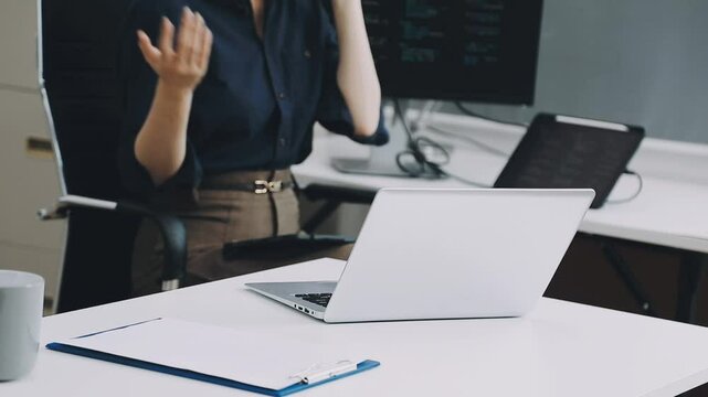 Two asian team working development of programming and encryption technology website design programmers on desk in office