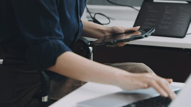 Two asian team working development of programming and encryption technology website design programmers on desk in office