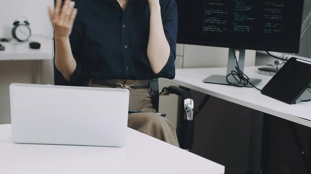 Two asian team working development of programming and encryption technology website design programmers on desk in office