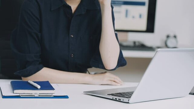 Two asian team working development of programming and encryption technology website design programmers on desk in office