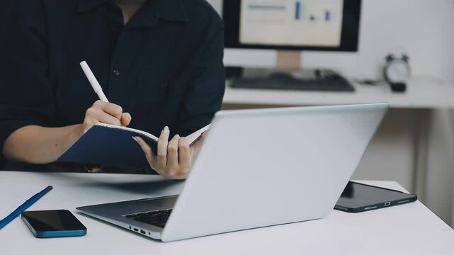 Two asian team working development of programming and encryption technology website design programmers on desk in office