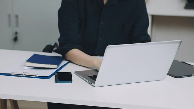 Two asian team working development of programming and encryption technology website design programmers on desk in office