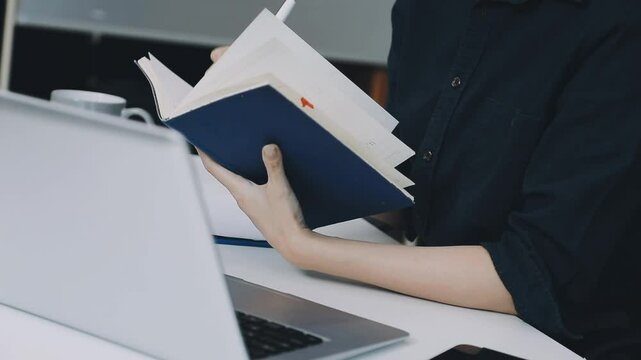 Two asian team working development of programming and encryption technology website design programmers on desk in office