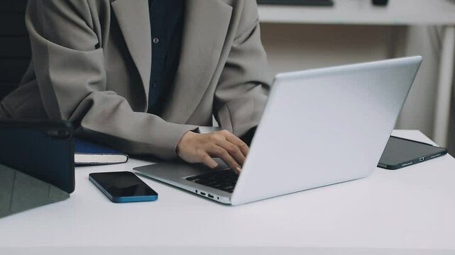 Two asian team working development of programming and encryption technology website design programmers on desk in office
