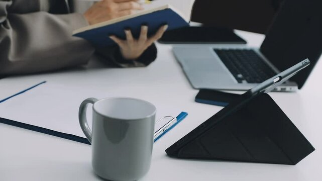 Two asian team working development of programming and encryption technology website design programmers on desk in office