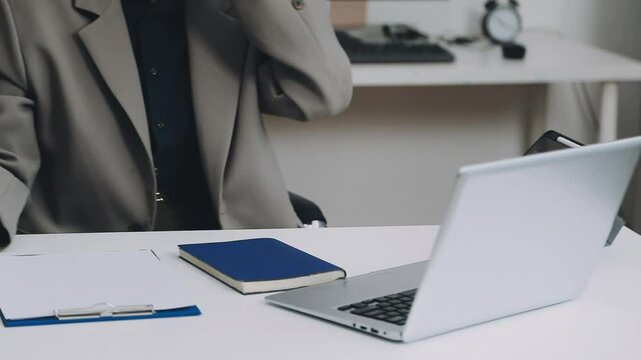 Two asian team working development of programming and encryption technology website design programmers on desk in office