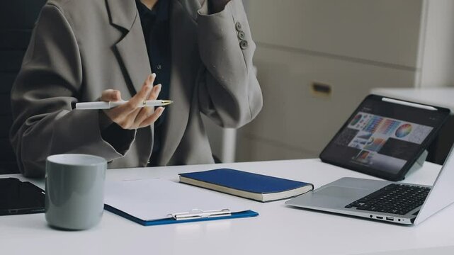 Two asian team working development of programming and encryption technology website design programmers on desk in office