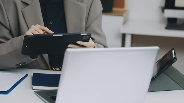 Two asian team working development of programming and encryption technology website design programmers on desk in office