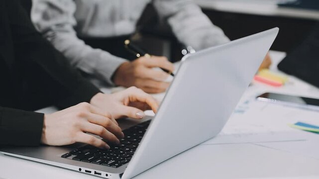 Two asian team working development of programming and encryption technology website design programmers on desk in office
