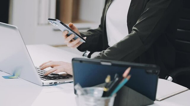 Two asian team working development of programming and encryption technology website design programmers on desk in office